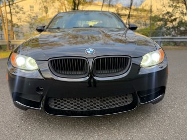 Salvage 2009 BMW M3  - Black Sedan - Front Three-Quarter View