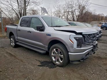 Salvage 2024 Ford F150 LIGHTNING XLT - Gray PickUp - Front Three-Quarter View