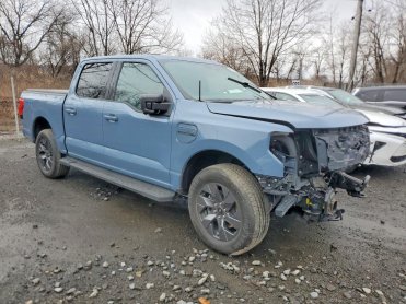 Salvage 2023 Ford F150 LIGHTNING PRO - Blue PickUp - Front Three-Quarter View