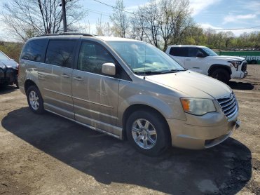 Salvage 2009 Chrysler Town &amp; Country Handicap - Gold Van - Front Three-Quarter View