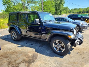 Salvage 2023 Jeep Wrangler SAHARA - Black SUV - Front Three-Quarter View