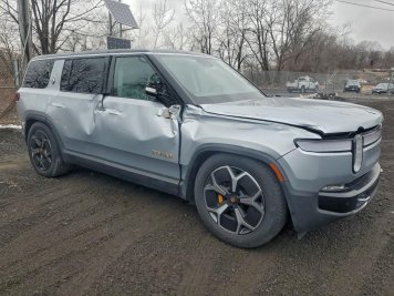 2023 rivian r1s ADVENTURE in Silver - Front Three-Quarter View - BidGoDrive Inventory