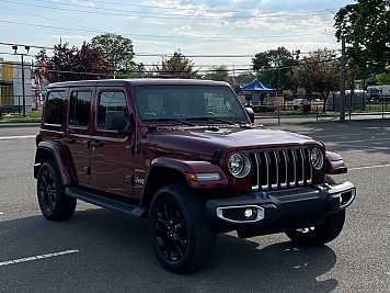 2022 jeep wrangler Sahara 4XE in Red- Front Three-Quarter View - BidGoDrive Inventory