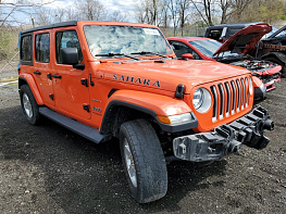 Salvage 2019 Jeep Wrangler UNLIMITED SAHARA - Red SUV - Front Three-Quarter View
