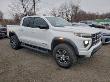 2024 gmc canyon AT4 in White - Front Three-Quarter View - BidGoDrive Inventory