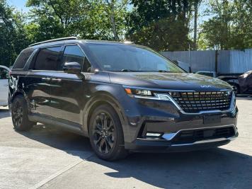 2023 kia carnival SX PRESTIGE in Black - Front Three-Quarter View - BidGoDrive Inventory