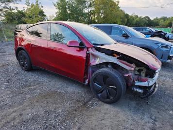 2026 tesla model-y  in Burgundy - Front Three-Quarter View - BidGoDrive Inventory