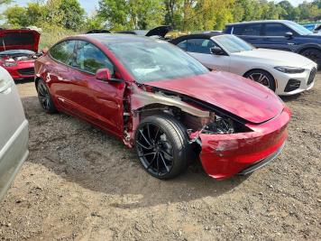 2026 tesla model-3 PERFORMANCE in Burgundy - Front Three-Quarter View - BidGoDrive Inventory