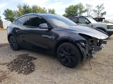 Salvage 2025 Tesla Model Y  - Gray Sedan - Front Three-Quarter View
