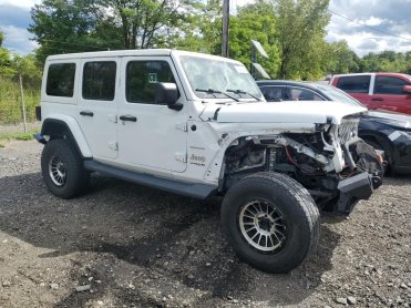 Salvage 2018 Jeep Wrangler UNLIMITED SAHARA - White SUV - Front Three-Quarter View