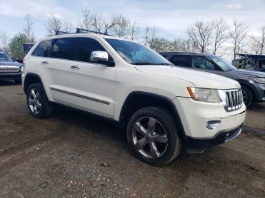 Salvage 2012 Jeep GRAND CHEROKEE OVERLAND - White SUV - Front Three-Quarter View