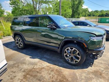 Salvage 2026 Rivian R1S ADVENTURE - Green SUV - Front Three-Quarter View