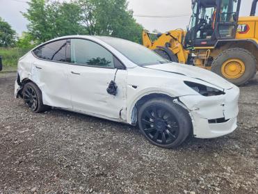 2023 Tesla Model Y  in White - Front Three-Quarter View - BidGoDrive Inventory