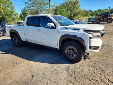 2025 Nissan Frontier PRO-4X in White - Front Three-Quarter View - BidGoDrive Inventory