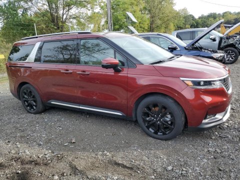 2023 KIA Carnival SX in Burgundy - Front Three-Quarter View - BidGoDrive Inventory