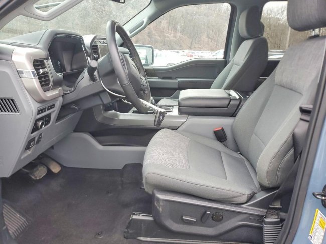 Salvage 2023 Ford F150 Lightning Pro in Синий