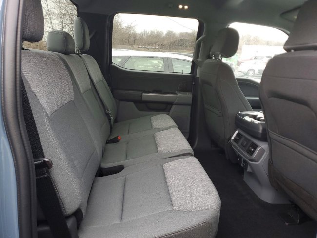 Salvage 2023 Ford F150 Lightning Pro in Синий