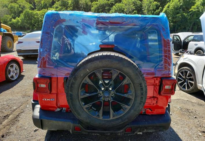 Salvage 2024 Jeep Wrangler Sahara 4xe in Red