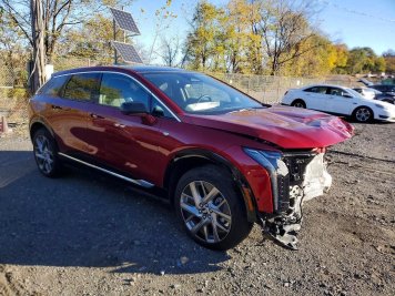 2025 cadillac optiq LUXURY in Burgundy - Front Three-Quarter View - BidGoDrive Inventory